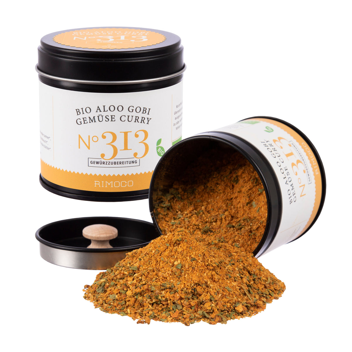 Zwei Dosen mit Aufschrift Bio Curry Gewürz-Set N°1, gemahlene Gewürze sind zu sehen.