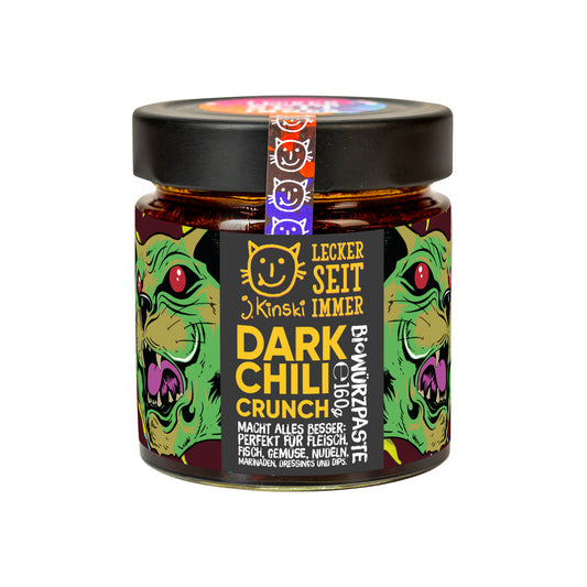 Bio Dark Chili Crunch mit Röstaroma, im Glas mit bunten Monster-Illustrationen auf dem Etikett.