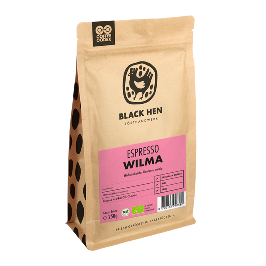 Braune Tüte Bio Espresso WILMA Kaffee, vorne ein pinkes Etikett sichtbar.