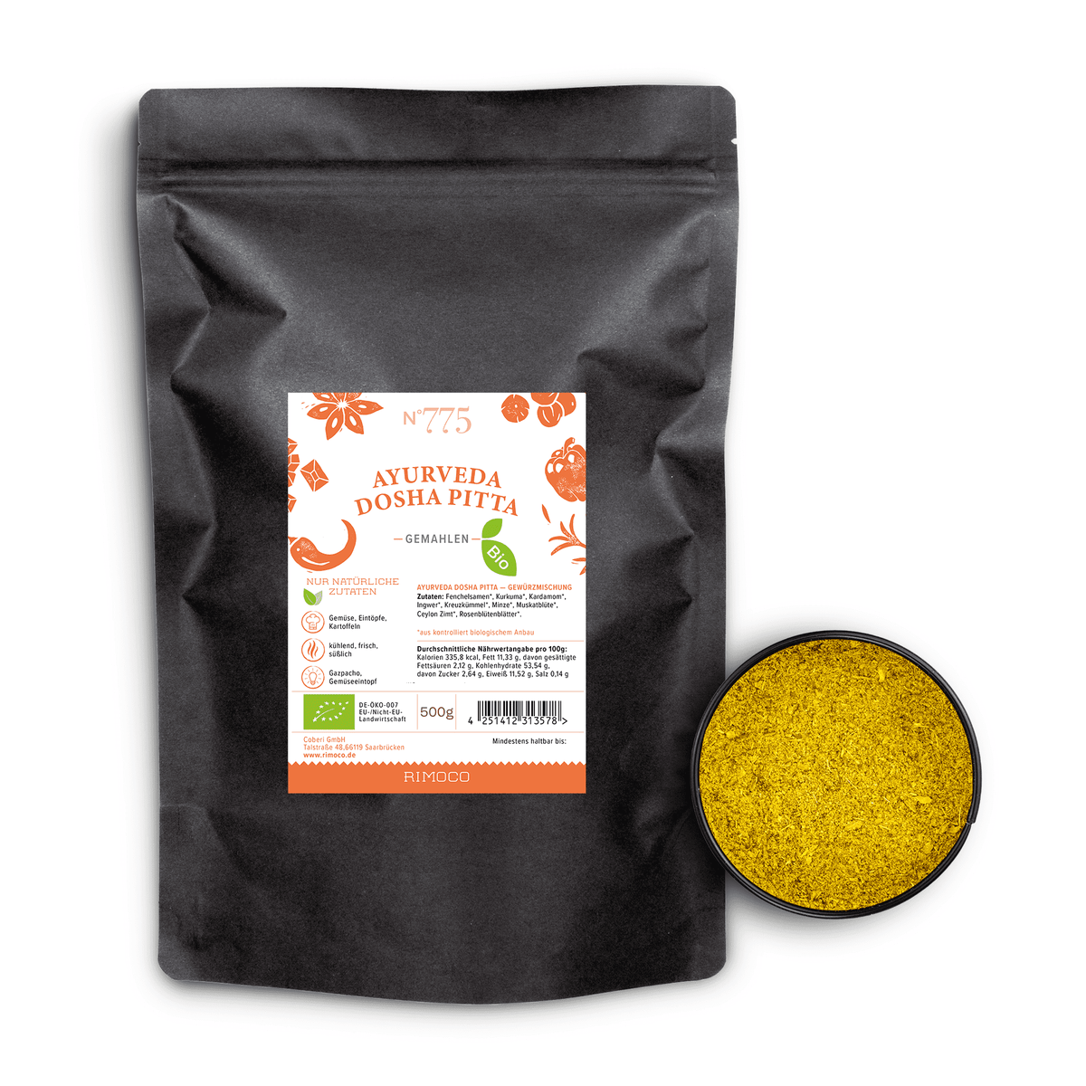 Schwarzer Beutel mit Aufschrift Bio Ayurveda Dosha Pitta neben einer Schale mit gelbem Pulver.
