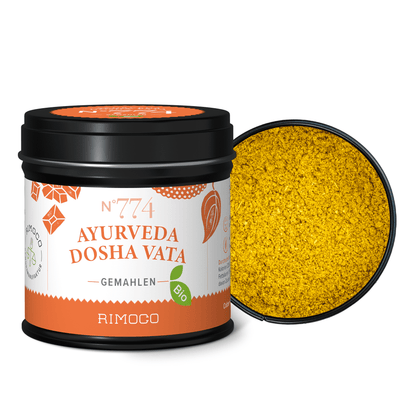 Bio Ayurveda Dosha Vata Dose mit gemahlenem gelben Gewürz, Deckel abgenommen.