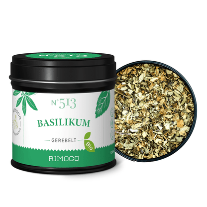 Dose Bio Basilikum gerebelt mit getrockneten Basilikumblättern neben dem offenen Deckel.