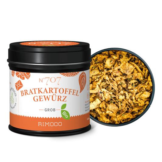 Schale mit grobem Gewürzmix für Bratkartoffeln, daneben ein Glas Bio Bratkartoffel Gewürz.