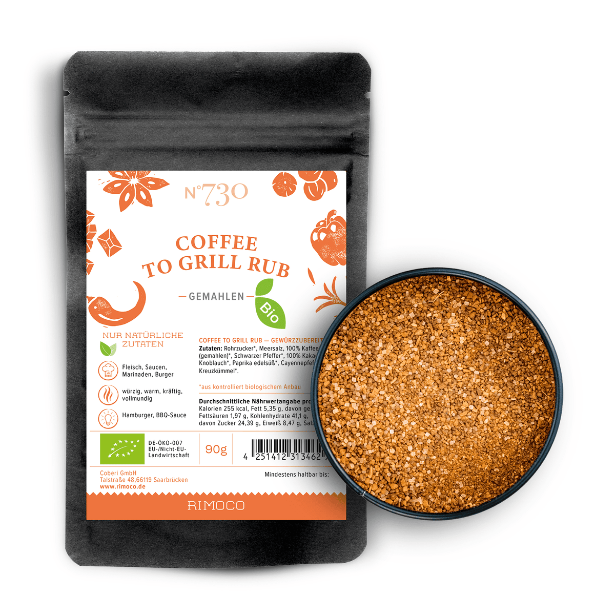 Schwarzer Beutel mit Aufschrift Bio Coffee To Grill Rub neben offenem Behälter mit Gewürzmischung.