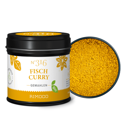 Geöffnete Dose mit Bio Fischcurry, darin gelbes Currypulver.