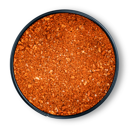Runde schwarze Schale mit Bio Fruit Bomb BBQ Rub, von oben gesehen.
