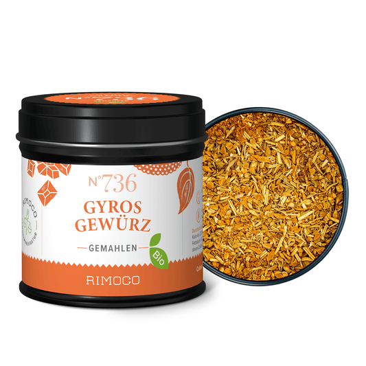 Offenes Glas Bio Gyros Gewürz mit sichtbarer, grober, orange-gelber Gewürzmischung.