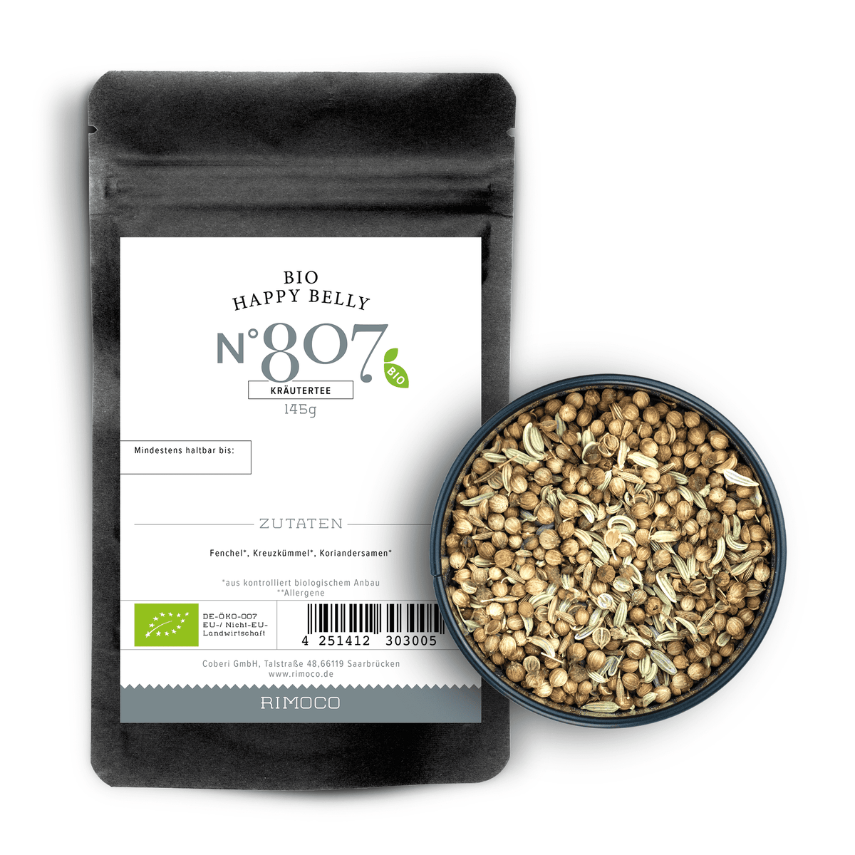 Bio Ayurveda Tee Happy Belly Kräutertee mit Fenchel neben einer Schale mit losen Kräutern.