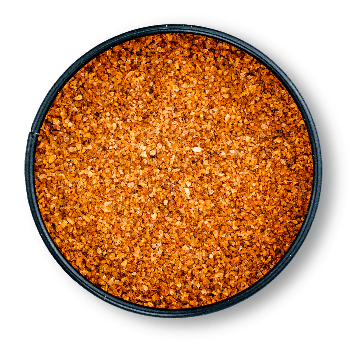 Rundes, schwarzes Gefäß mit grobem, orange-braunem Bio Magic Dust Rub von oben gesehen.