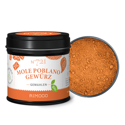 Offene Dose mit Bio Mole Poblano Gewürz, darin orange-braunes, gemahlenes Ancho-Chili-Pulver.