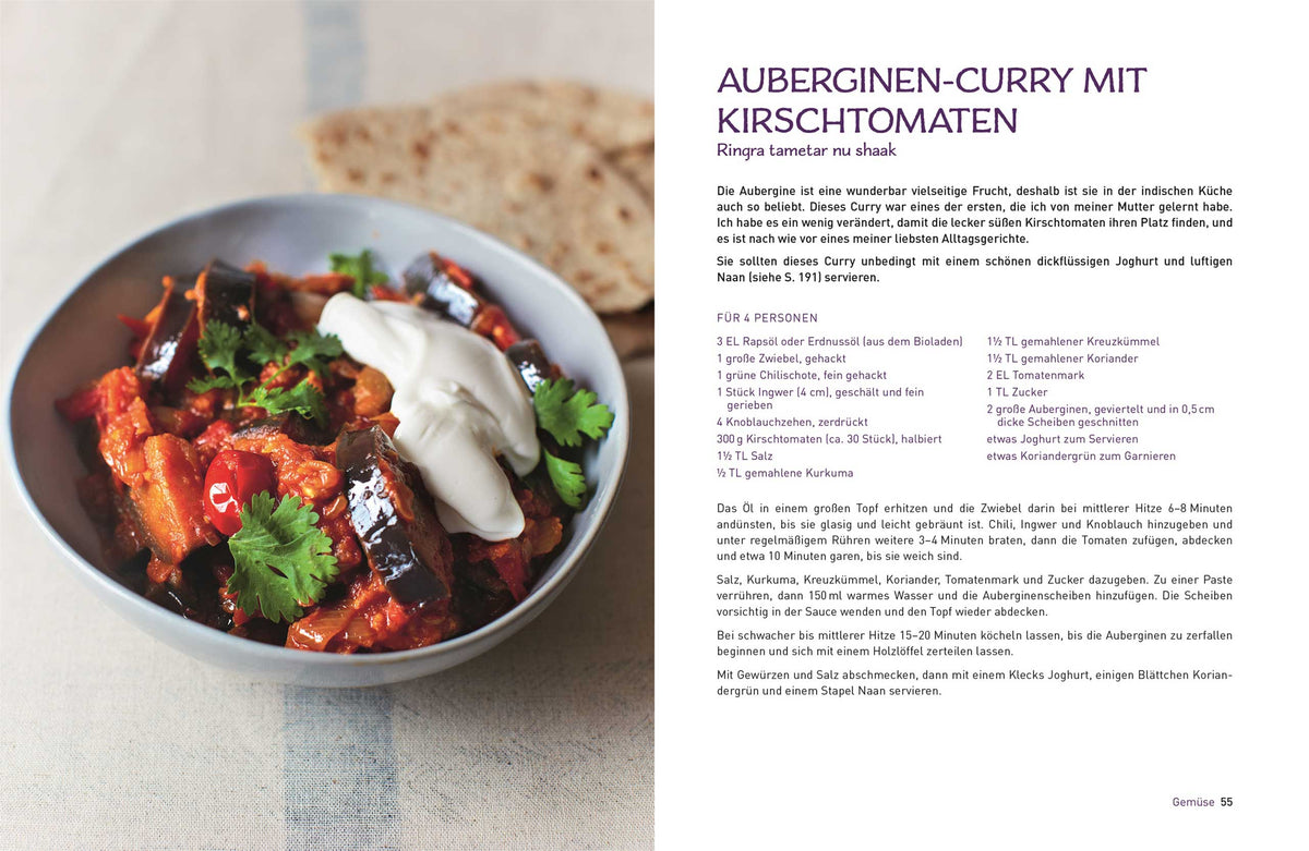 Eine Schüssel Original Indisch vegetarische Currys mit Tomaten, Koriander, Joghurt und Brot.