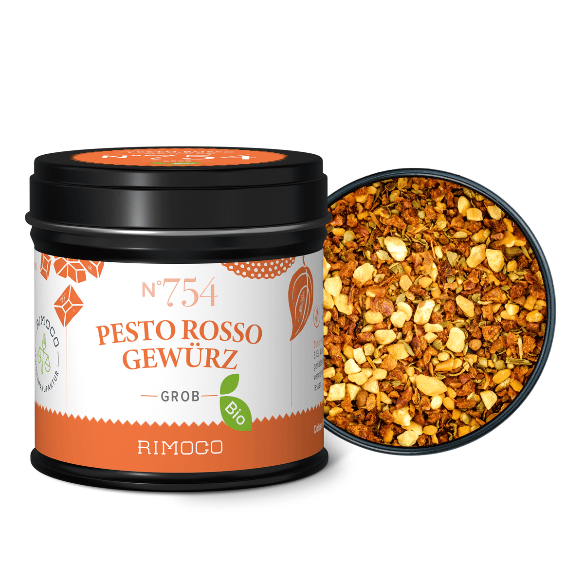 Ein offenes Glas Bio Pesto Rosso zeigt die grobe, leuchtend rote italienische Sauce im Inneren.