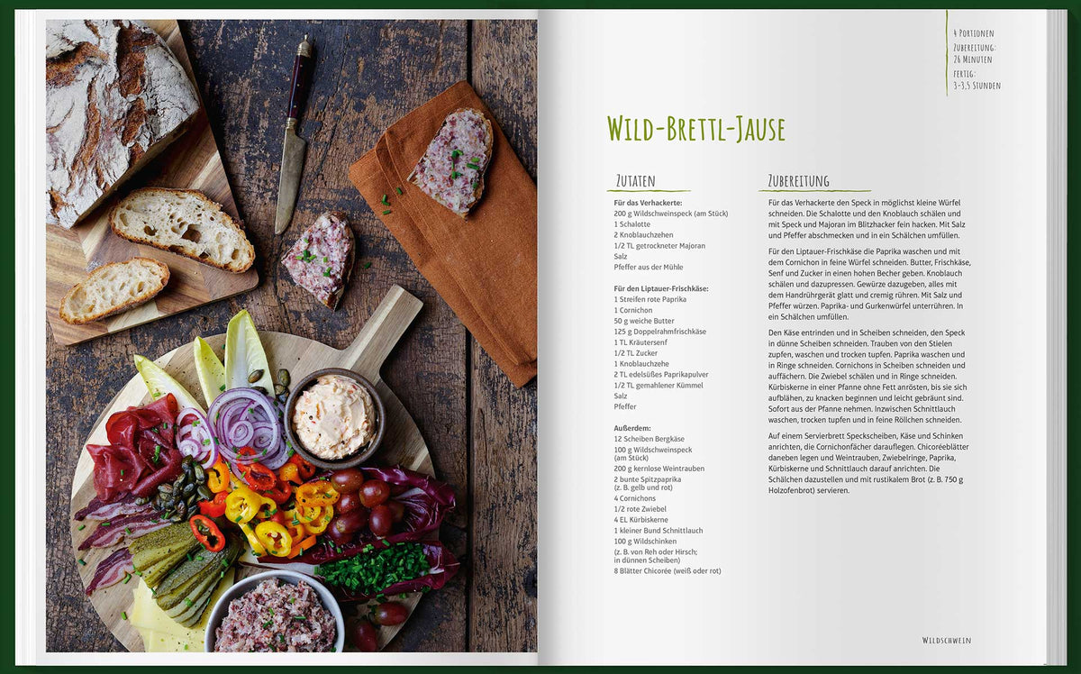 Rustikaler Aufstrich mit Brot, Pastete, Käse, Gemüse und einem Einfach mal Wild Kochbuch.