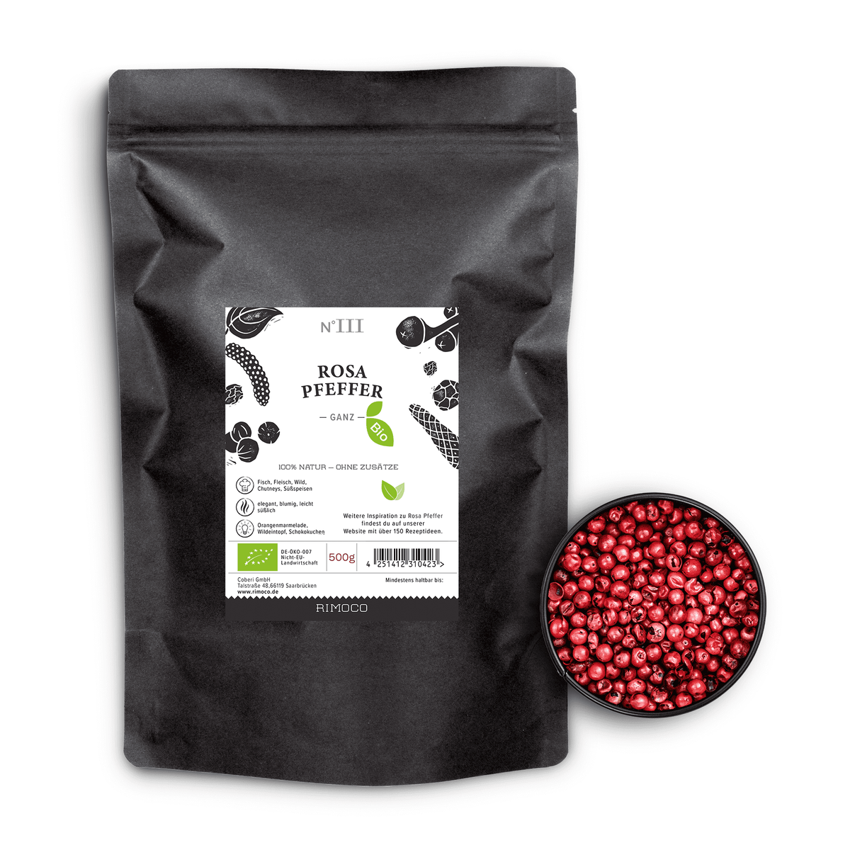Bio Rosa Pfeffer in schwarzem Beutel neben einer Schale mit ganzen rosafarbenen Pfefferbeeren.
