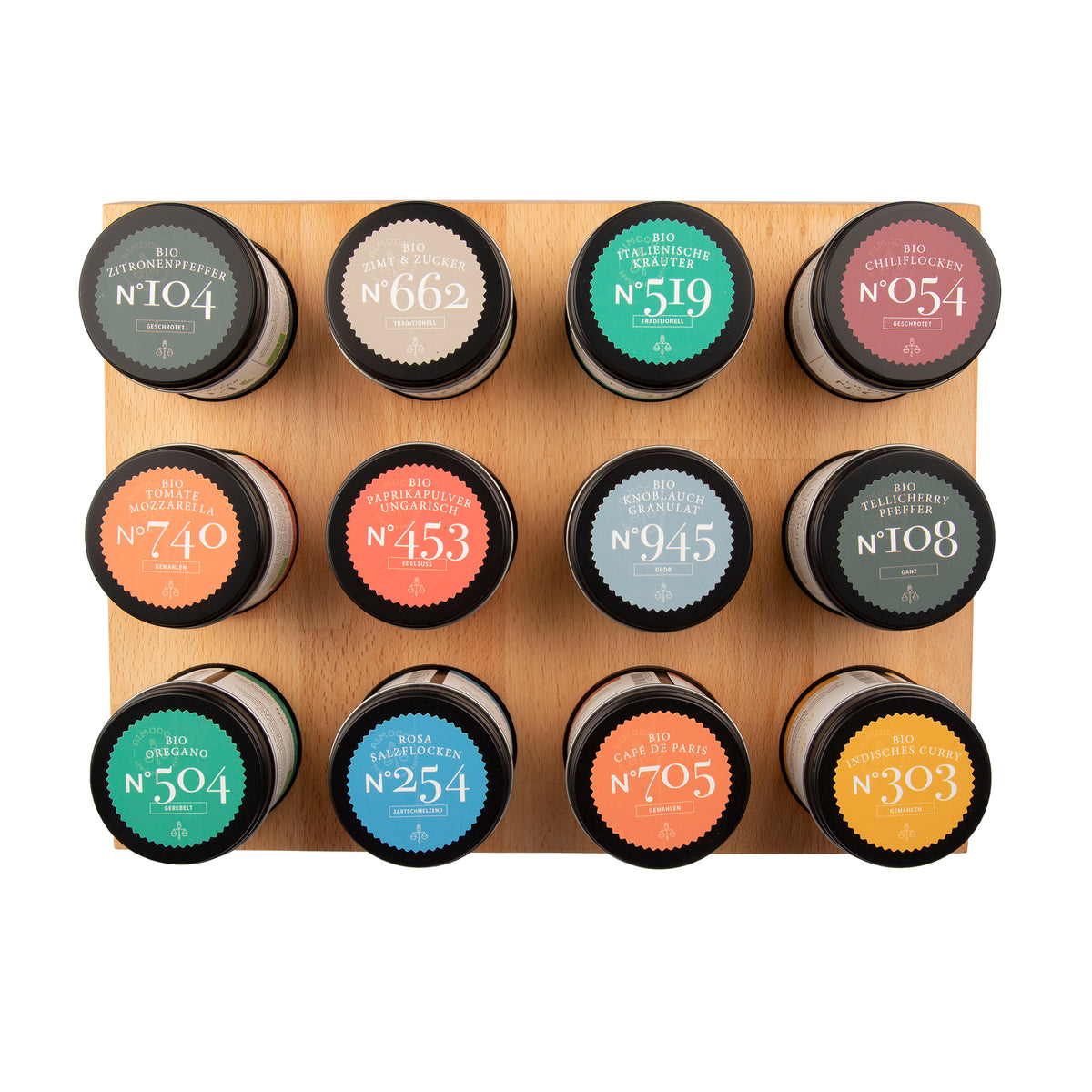 12 Rimoco Aroma-Dosen im magnetischen Regal, bunt sortiert in 4x3 Anordnung, aus der Vogelperspektive.