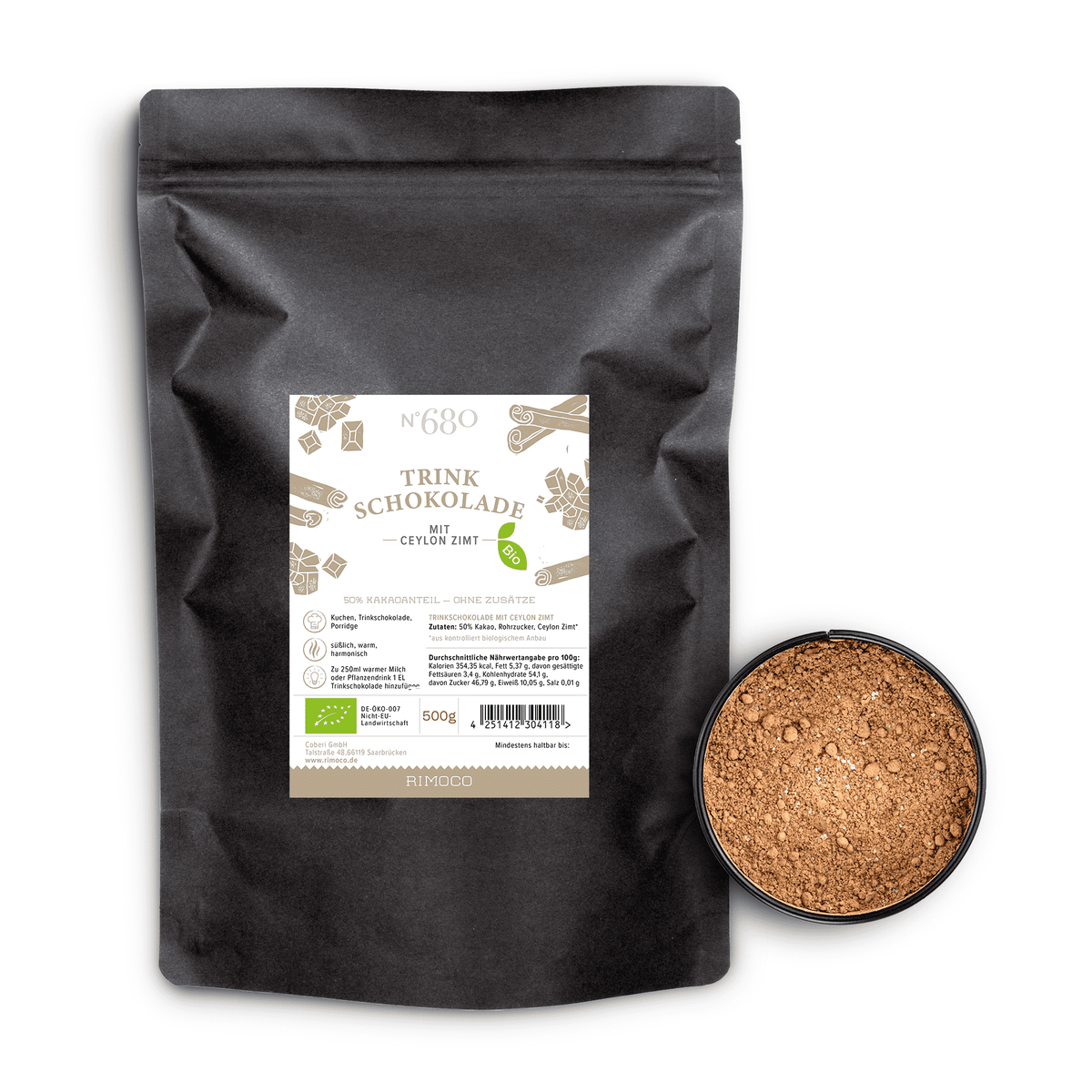 Bio Trinkschokolade mit Ceylon Zimt, daneben runde Dosis mit Kakaopulver.