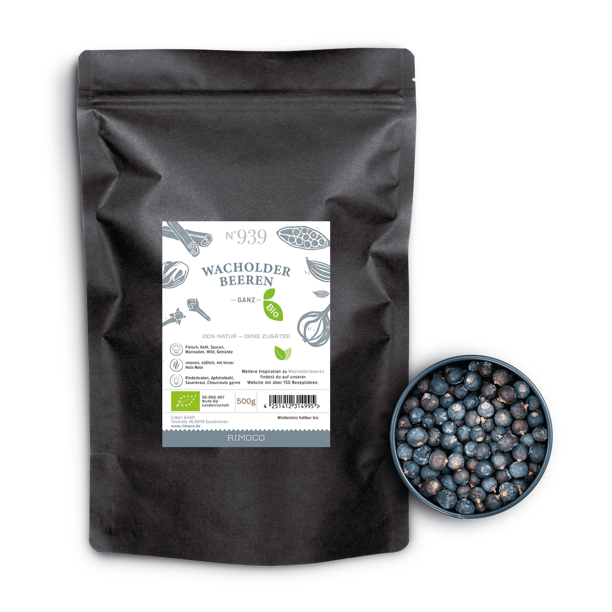 Bio Wacholderbeeren in schwarzer Tüte neben einer Schale mit getrockneten Wacholderbeeren.