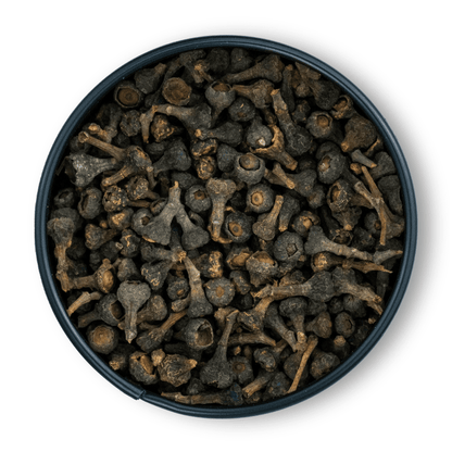 Runde Dose mit Zimtblüten ganz, getrocknete dunkelbraune Stiele und Wurzeln von oben sichtbar.